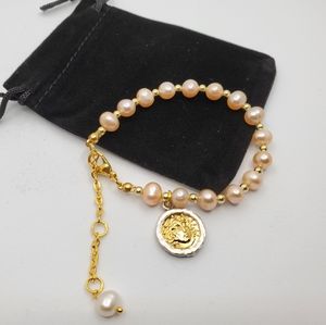 Pink pearl bracelet with coin pendant